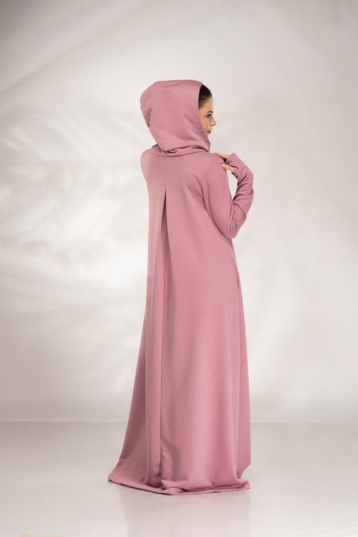 Women’s dusty pink hooded maxi sweatshirt dress, back view showing the hood and inverted box pleat