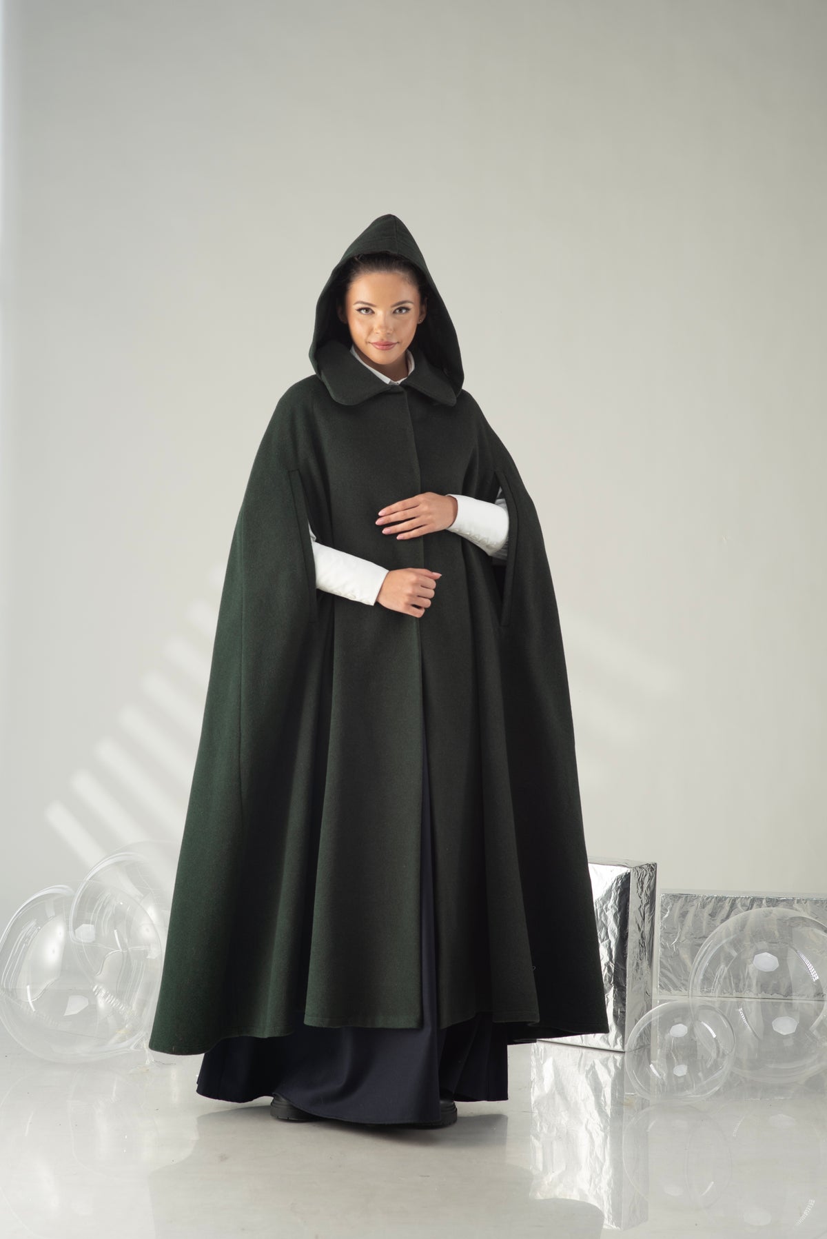 Women's hooded cape coat in dark green with elegant collar