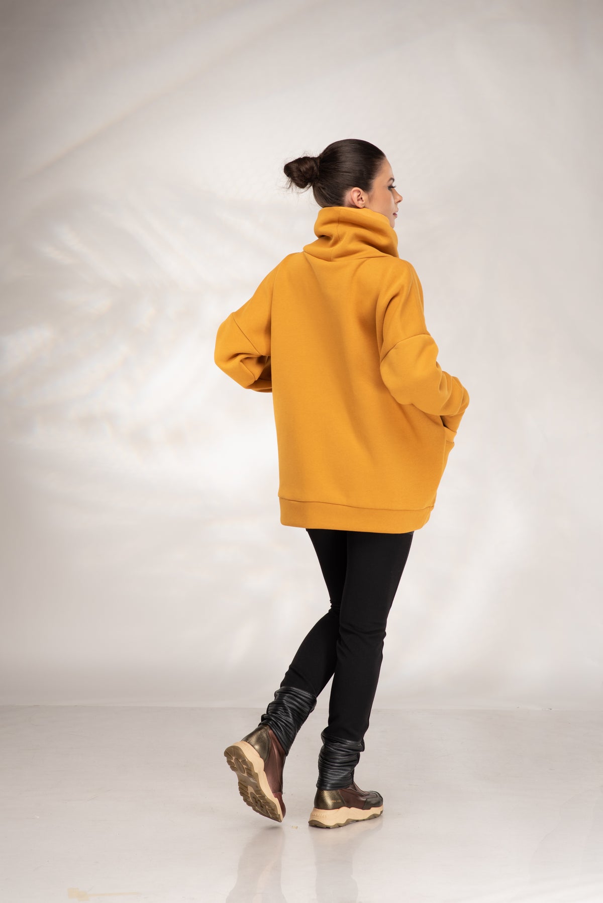 Women's mustard oversized sweatshirt with cowl neck and relaxed dropped shoulders, back view