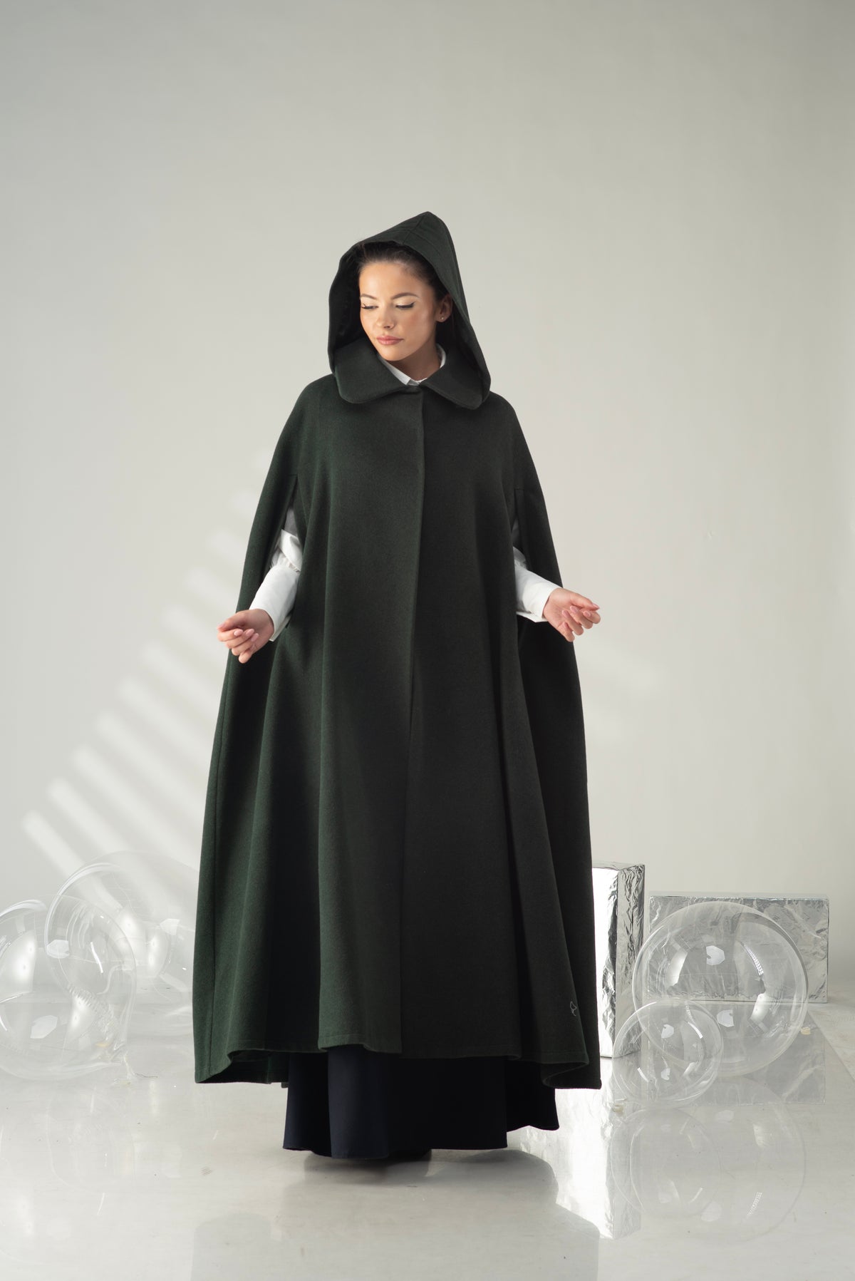 Women's hooded cape coat with long flowing silhouette