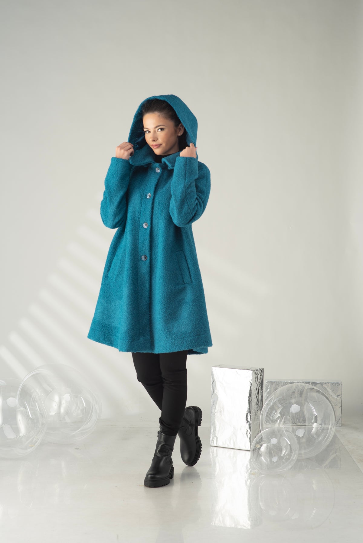 Women's teal hooded swing coat with button front and oversized hood